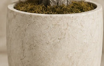 Weighted limestone-composite pot